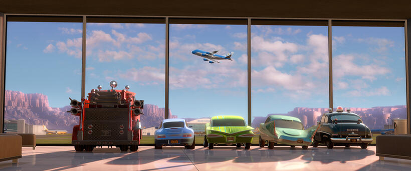 Red, Sally Carrera voiced by Bonnie Hunt, Ramone voiced by Cheech Marin, Flo voiced by Jenifer Lewis, Sheriff voiced by Michael Wallis in "Cars 2."