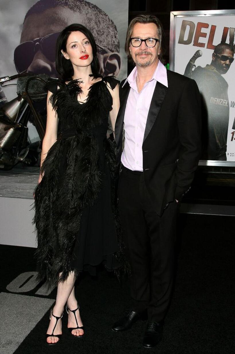 Gary Oldman and Guest at the California premiere of "The Book Of Eli."