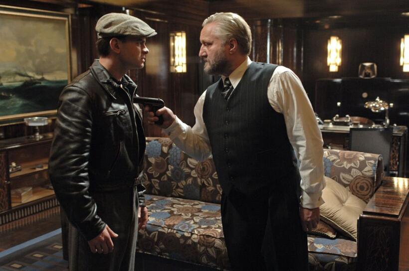 Clovis Cornillac as Milou and Bernard-Pierre Donnadieu as Galapiat in "Paris 36."