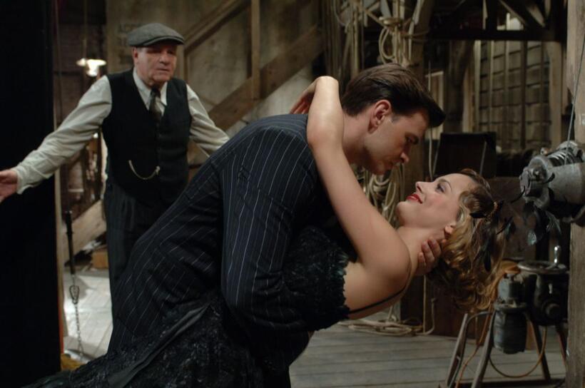 Clovis Cornillac as Milou and Nora Arnezeder as Douce in "Paris 36."