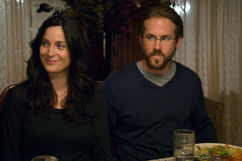 Carrie-Anne Moss and Ryan Reynolds in "Fireflies in the Garden."