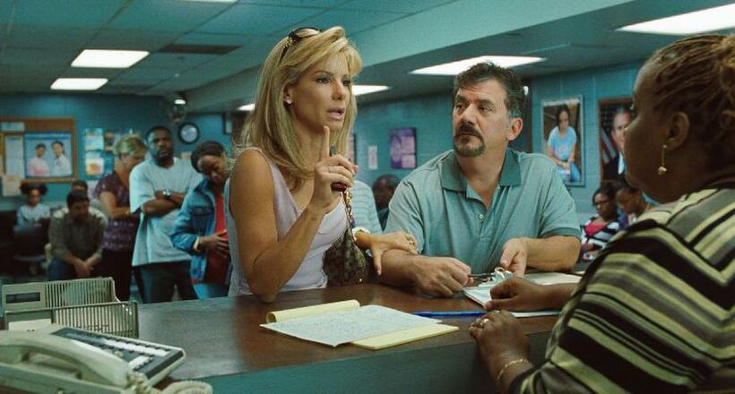 Sandra Bullock as Leigh Anne Tuohy and Maria Howell as CPS welfare worker in "The Blind Side."