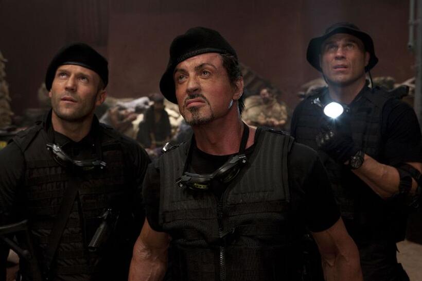 Jason Statham as Lee Christmas, Sylvester Stallone as Barney Ross and Randy Couture as Toll Road in "The Expendables."