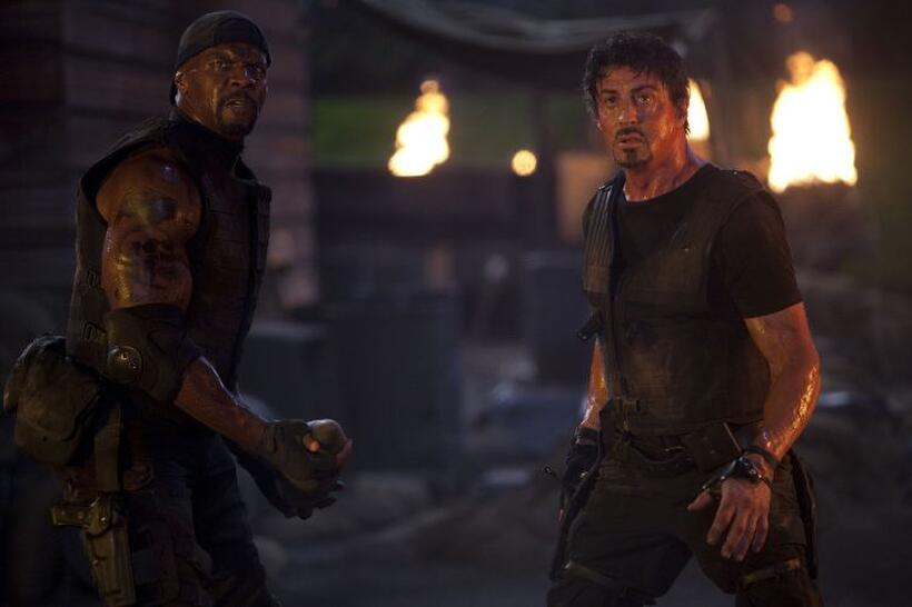 Terry Crews as Hale Caesar and Sylvester Stallone as Barney Ross in "The Expendables."