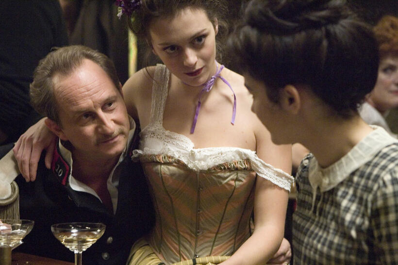Benoit Poelvoorde as Etienne Balsan, Girl and Audrey Tautou as Coco Chanel in "Coco Before Chanel."