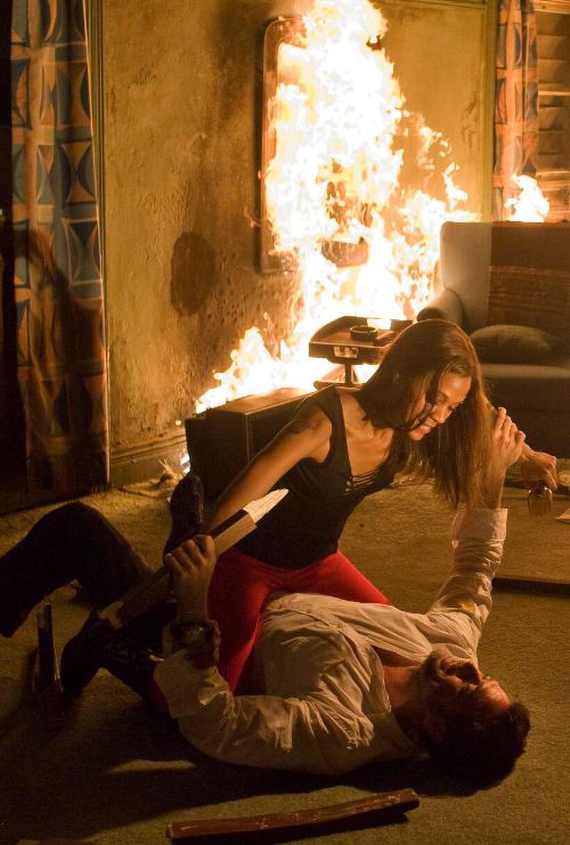 Zoe Saldana as Aisha and Jeffrey Dean Morgan as Clay in "The Losers."