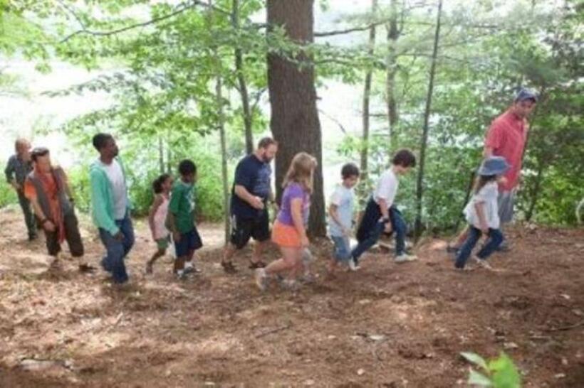 Adam Sandler as Lenny, Alexys Nycole Sanchez as Becky, Jake Goldberg as Greg, Cameron Boyce as Keithie, Ada-Nicole Sanger as Donna Lamonsoff, Frank Gingerich as Bean Lamonsoff, Kevin James as Eric Lamonsoff, Nadji Jeter as Andre McKenzie, Chris Rock as Kurt, China Anne McClain as Charlotte, Rob Schneider as Rob, and David Spade as Marcus Higgins in "Grown Ups."