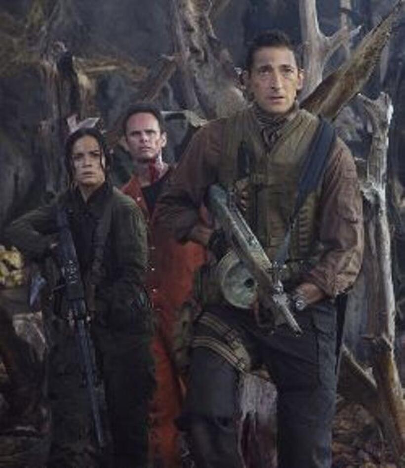 Alice Braga as Isabelle, Walton Goggins as Stans and Adrien Brody as Royce in "Predators."