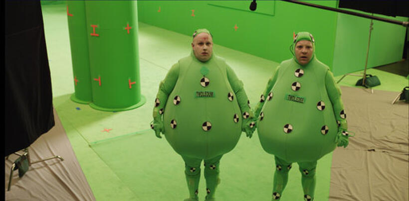 Tweedles Progression 1 of 6: To start the shot of the Tweedles in the Red Queen's throne room, Matt Lucas (left) is photographed on the green-screen stage wearing the "Tweedle suit."