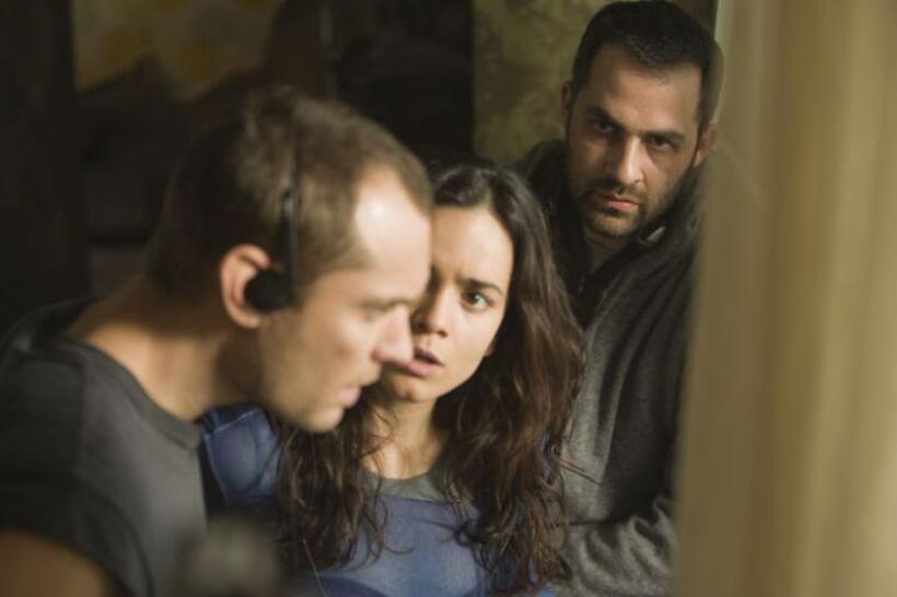 Jude Law, Alice Braga and director Miguel Sapochnik on the set of "Repo Men."