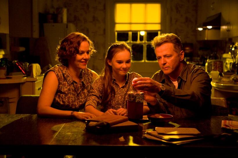 Penelope Ann Miller as Trina Baker, Madeline Carroll as Juli Baker and Aidan Quinn as Richard Baker in "Flipped."