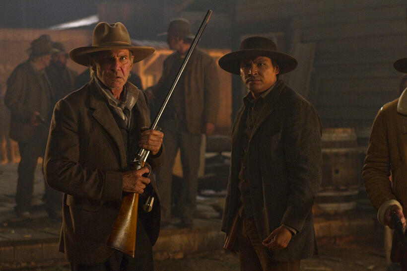 Harrison Ford as Colonel Dolarhyde and Adam Beach as Nat Colorado in "Cowboys & Aliens."