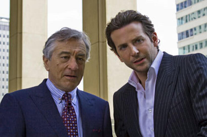 Robert de Niro as Carl Van Loon and Bradley Cooper as  Eddie Morra in "Limitless."