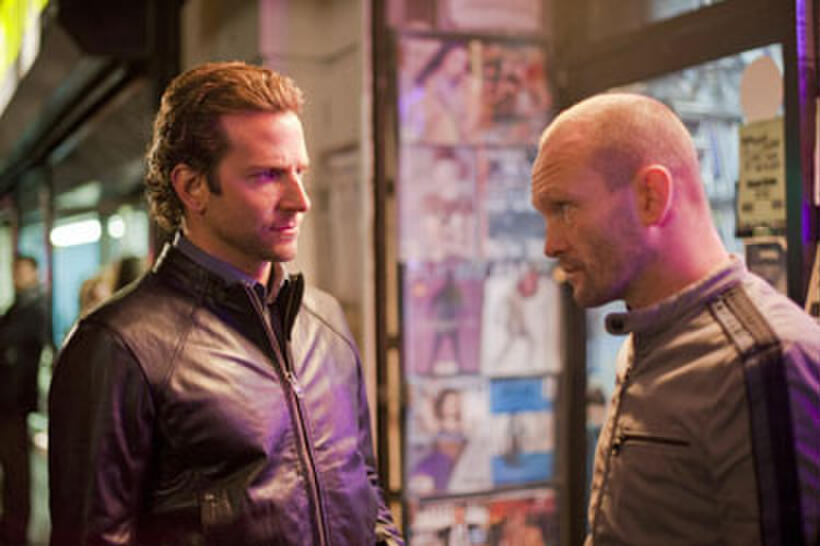 Bradley Cooper as Eddie Morra and Andrew Howard as Gennady in "Limitless."