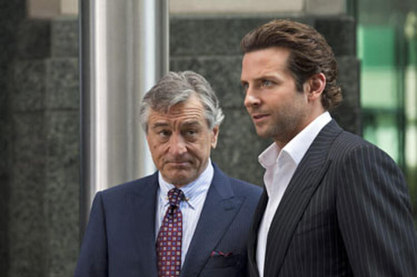 Robert de Niro as Carl Van Loon and Bradley Cooper as Eddie Morra in "Limitless."