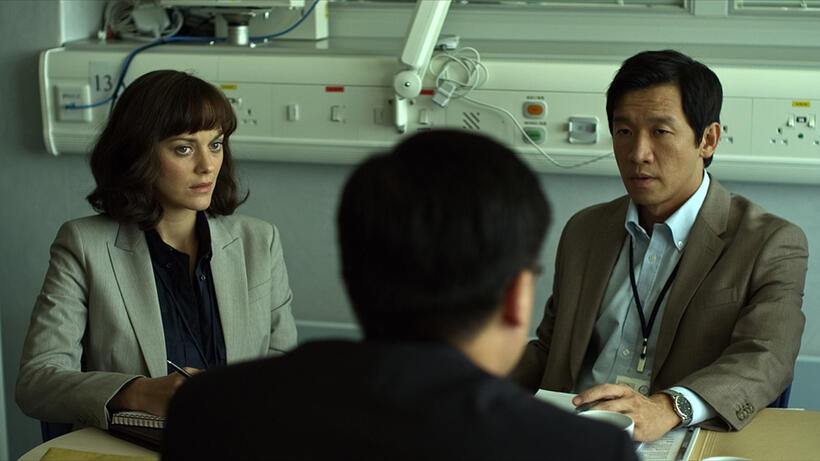 Marion Cotillard as Dr. Leonora Orantes and Chin Han as Sun Feng in "Contagion."