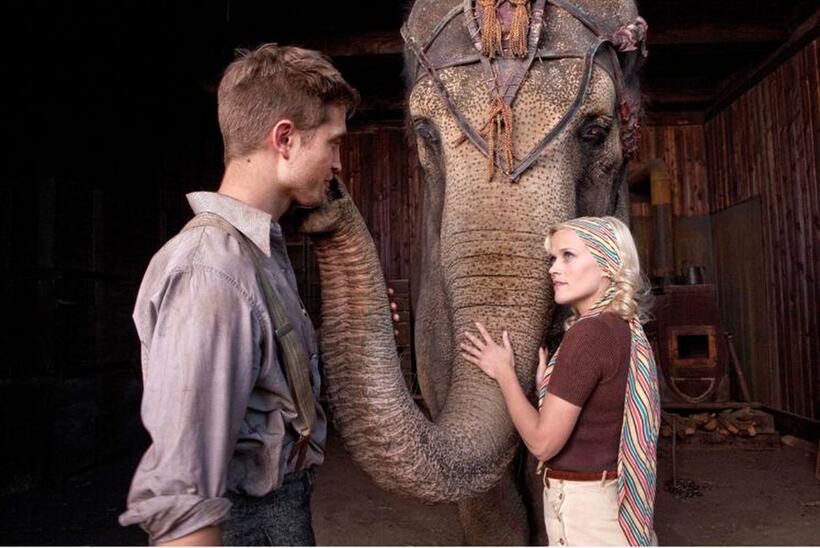 Robert Pattinson as Jacob, Rosie the elephant and Reese Witherspoon as Marlena in "Water for Elephants."