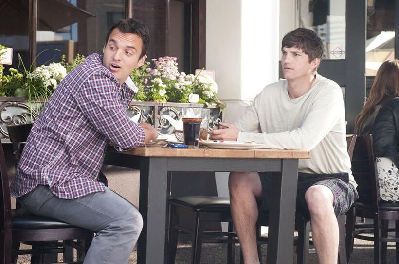 Jake Johnson as Eli and Ashton Kutcher as Adam in "No Strings Attached."