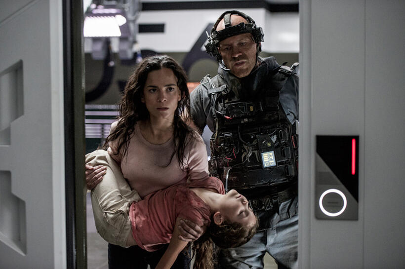 Alice Braga as Throws Frey, Emma Tremblay as Matilda and Josh Blacker as Crowe in "Elysium."