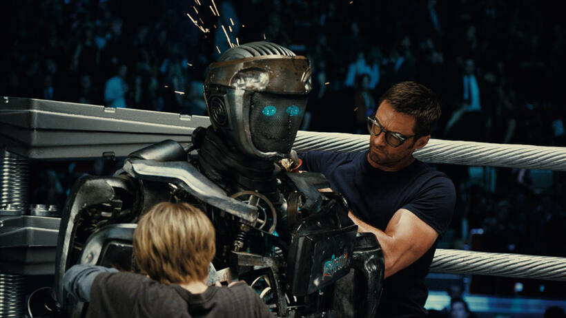 Dakota Goyo as Max, Atom and Hugh Jackman as Charlie Kenton in "Real Steel."