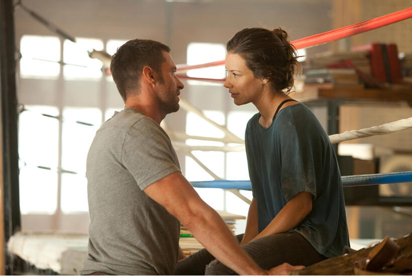 Hugh Jackman as Charlie Kenton and Evangeline Lilly as Bailey Tallet in "Real Steel.''