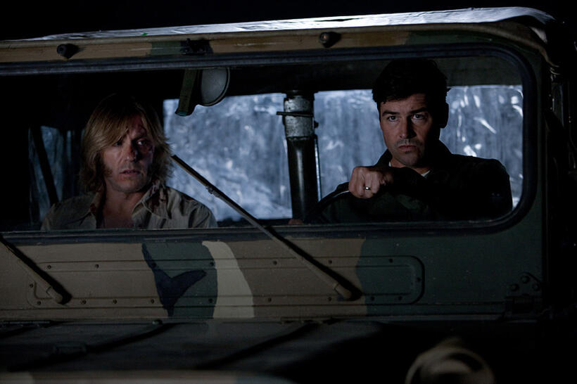 Ron Eldard as Louis Dainard and Kyle Chandler as Jackson Lamb in "Super 8."