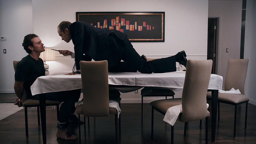 Clayne Crawford and David Hyde Pierce in "The Perfect Host."