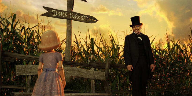 China Girl voiced by Joey King and James Franco as Oscar Diggs in "Oz: The Great and Powerful."