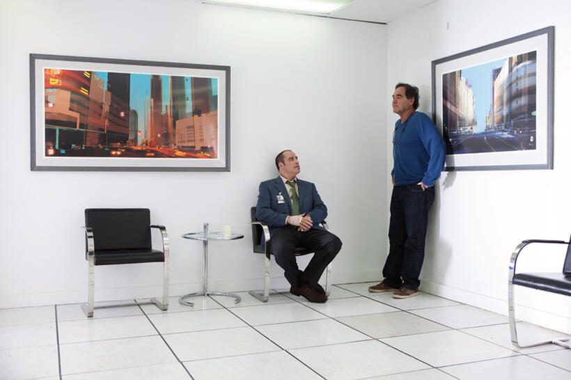 John Travolta and director Oliver Stone on the set of "Savages."