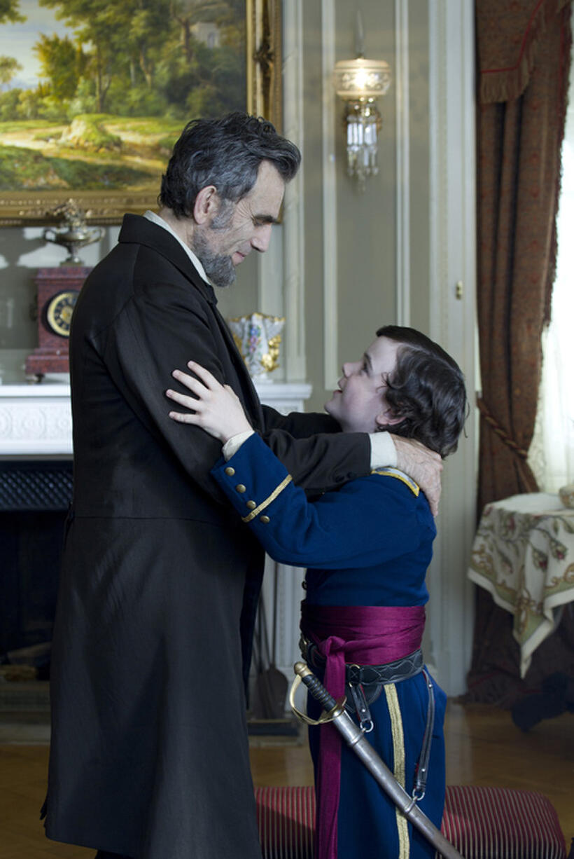 Daniel Day-Lewis as president Abraham Lincoln and Gulliver McGrath as Tad Lincoln in "Lincoln."