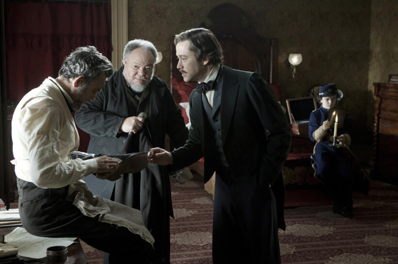 Daniel Day-Lewis as Abraham Lincoln, Stephen McKinley Henderson as William Slade, Joseph Gordon-Levitt as Robert Todd Lincoln and Gulliver McGrath as Tad Lincoln in "Lincoln."