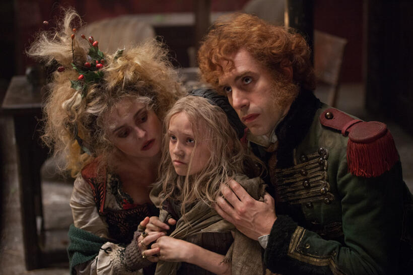 Helena Bonham Carter, Isabelle Allen and Sacha Baron Cohen in "Les Miserables."