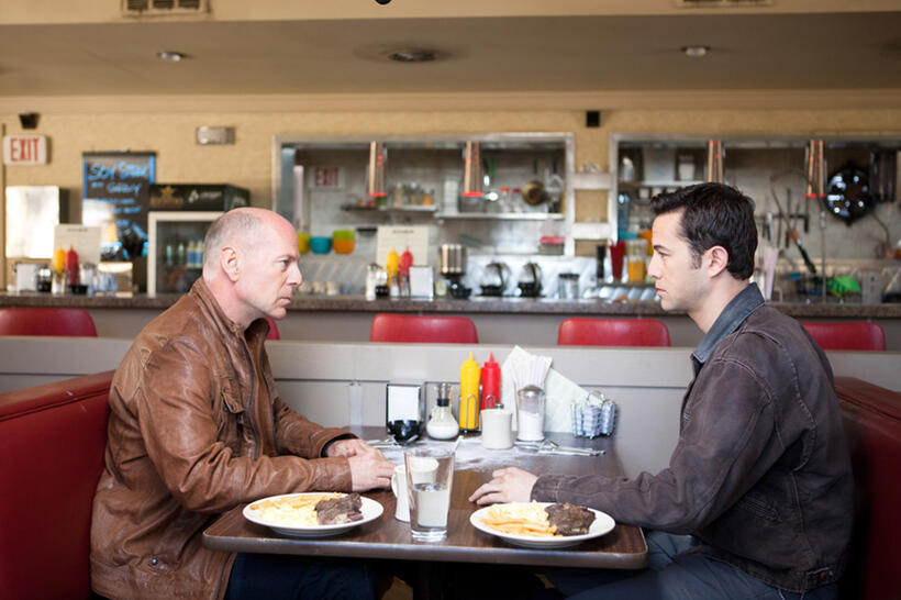 Bruce Willis as Joe and Joseph Gordon-Levitt as Joe in "Looper."