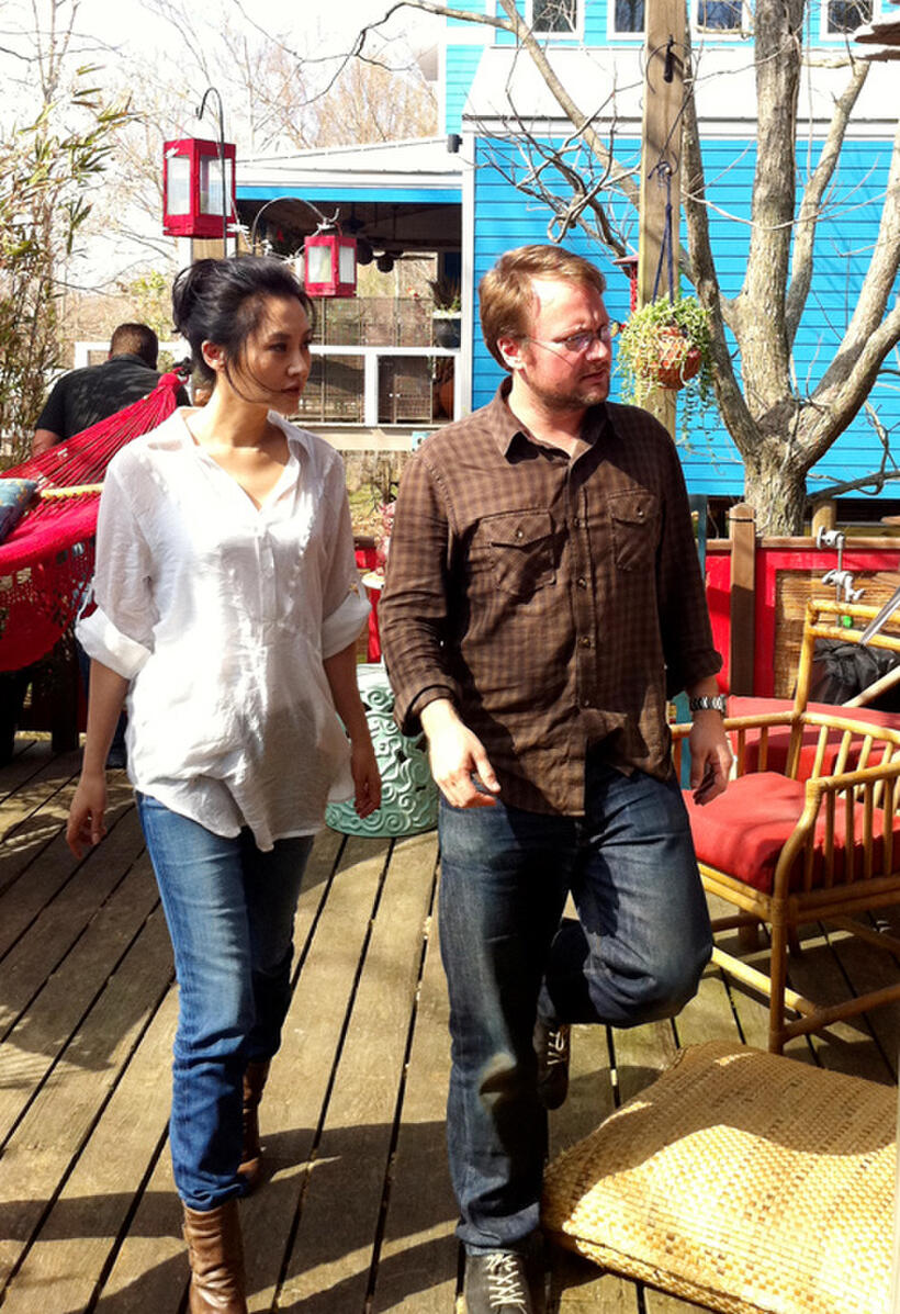 Summer Qing and Rian Johnson on the set of "Looper."