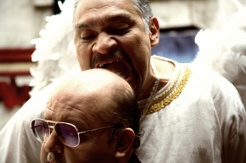 Carlos Cobos as Sacerdote Mundo Posadas and Joaquin Cosio as Agente Jesus Juarez in "Pastorela."