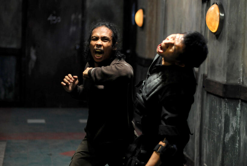 Yayan Ruhian as Mad Dog and Eka "Piranha" Rahmadia as Dagu in "The Raid."