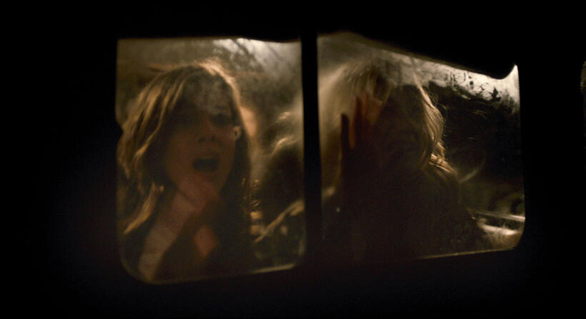 Devin Kelley as Amanda and Olivia Taylor Dudley as Natalie in "Chernobyl Diaries."