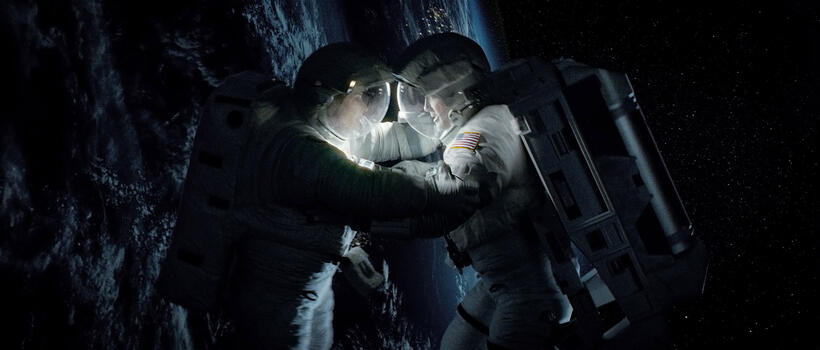 Sandra Bullock as Ryan Stone and George Clooney as Matt Kowalski in "Gravity."