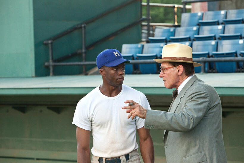 Chadwick Boseman as Jackie Robinson and Harrison Ford as Branch Rickey in "42."