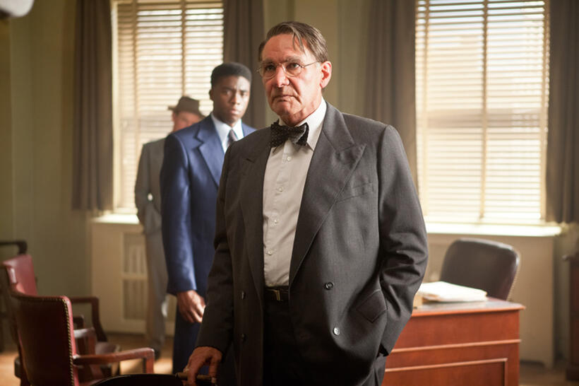 Chadwick Boseman as Jackie Robinson and Harrison Ford as Branch Rickey in "42."