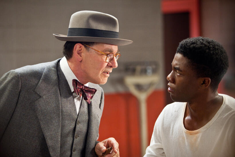Harrison Ford as Branch Rickey and Chadwick Boseman as Jackie Robinson in "42."