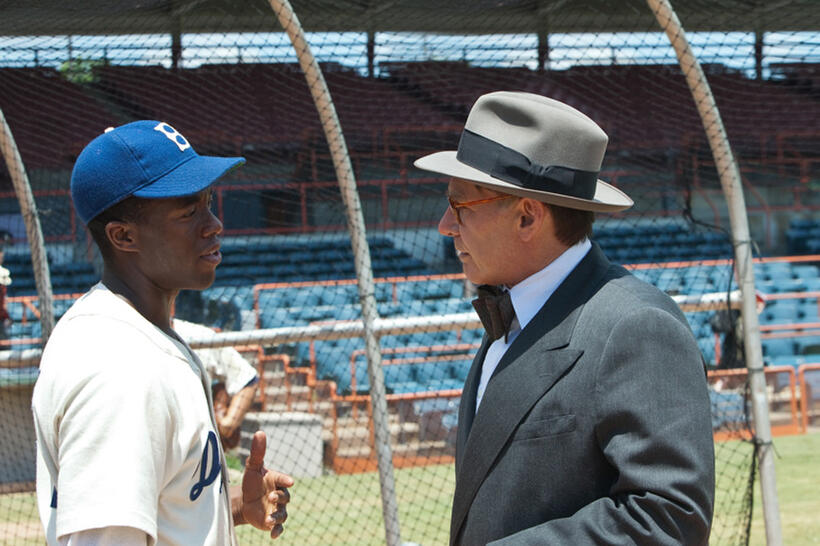 Chadwick Boseman as Jackie Robinson and Harrison Ford as Branch Rickey in "42."