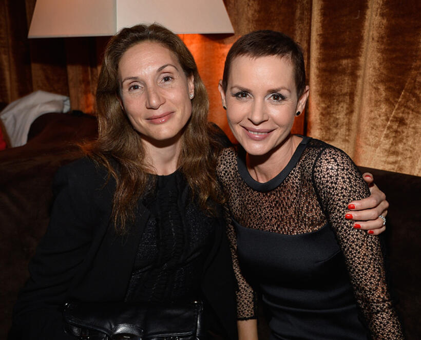 Embeth Davidtz and guest at the California premiere of "Paranoia."