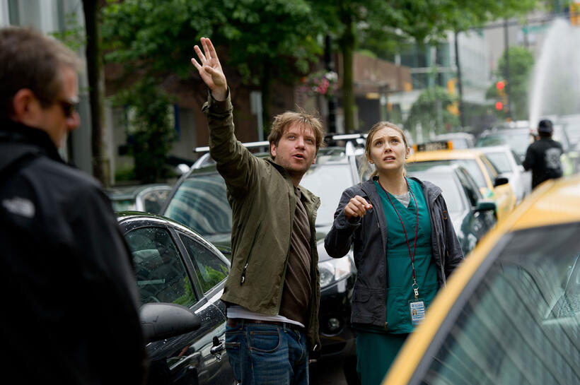 Director Gareth Edwards and Elizabeth Olsen on the set of "Godzilla."
