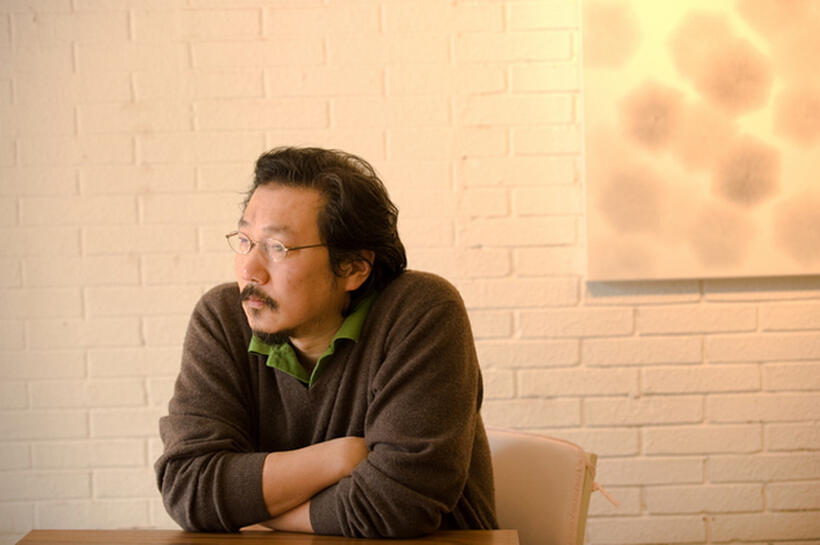 Director Hong Sang-soo on the set of "In Another Country."