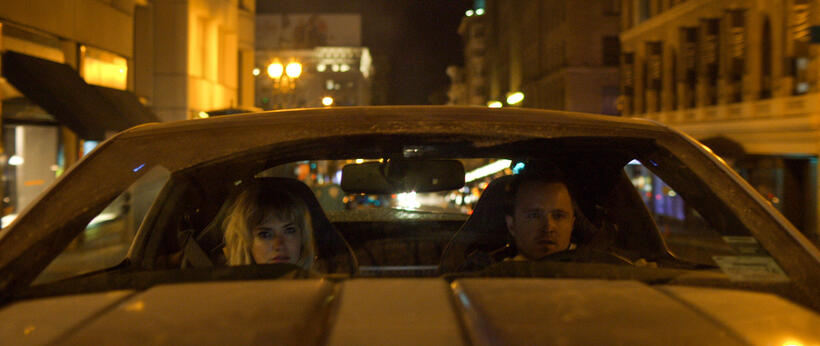 Imogen Poots as Julia Bonet and Aaron Paul as Tobey Marshall in "Need For Speed."