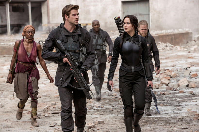 Patina Miller as Commander Paylor, Liam Hemsworth as Gale Hawthorne, Mahershala Ali as Boggs, Jennifer Lawrence as Katniss Everdeen and Elden Henson as Pollux in "The Hunger Games: Mockingjay, Part 1."