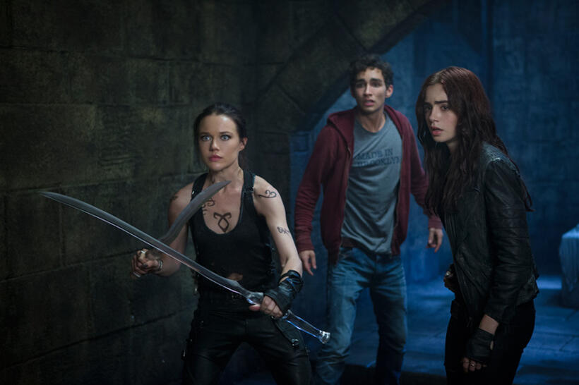 Jemima West as Isabelle Lightwood, Robert Sheehan as Simon Lewis and Lily Collins as Clary Fray in "The Mortal Instruments: City of Bones."