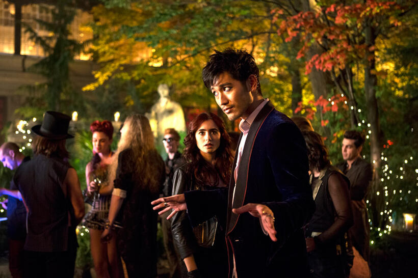 Lily Collins as Clary Fray and Godfrey Gao as Magnus Bane in "The Mortal Instruments: City of Bones."