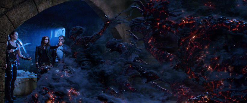 Jemina West as Isabelle and Lily Collins as Clary Fray in "The Mortal Instruments: City of Bones."